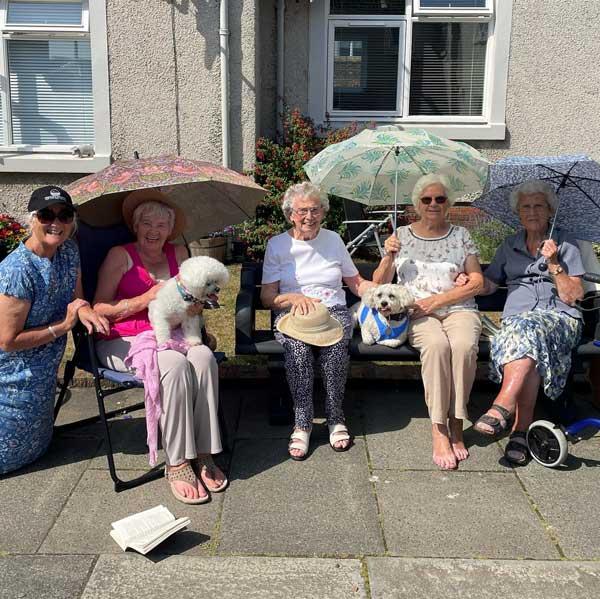 Anderson Court Tenants Sitting In The Sun