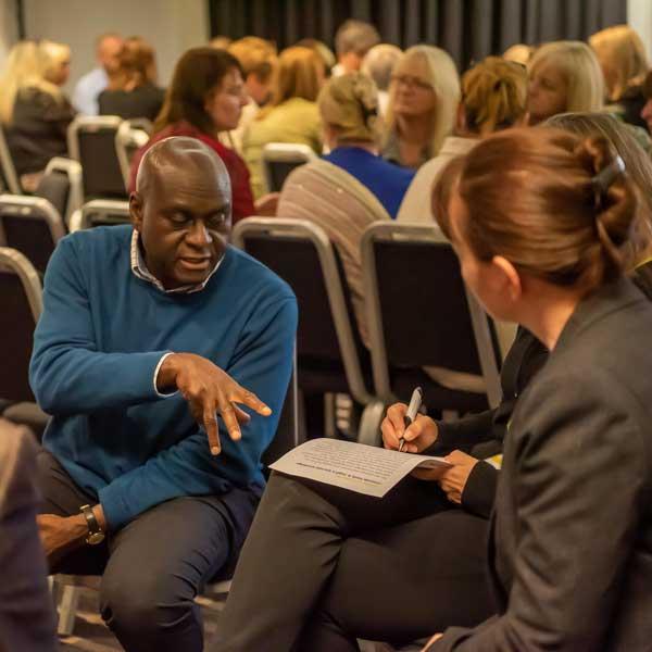 Staff Talking At Workshop